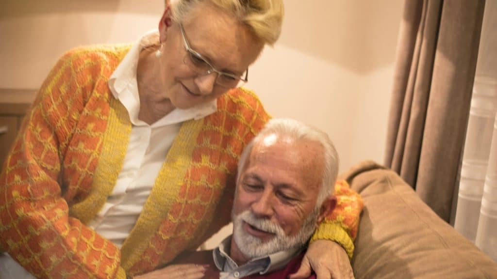 Senior couple using the phone.