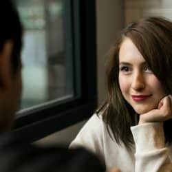 A woman looking at her man with love.