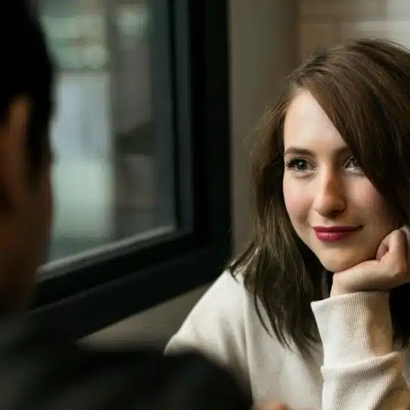 A woman looking at her man with love.