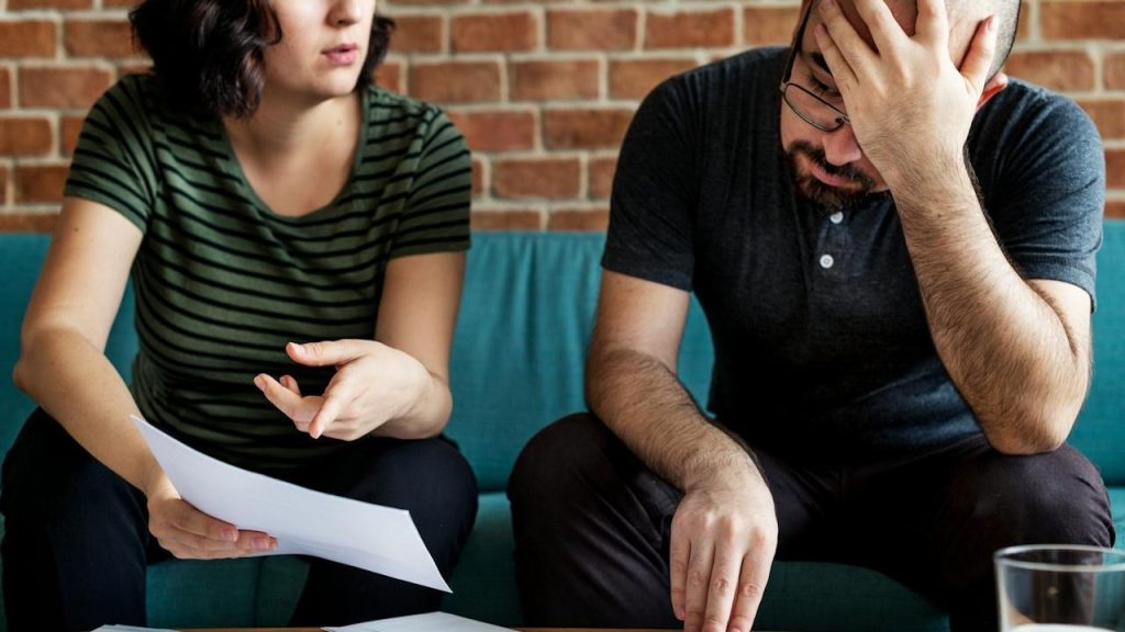 A couple managing the debt.