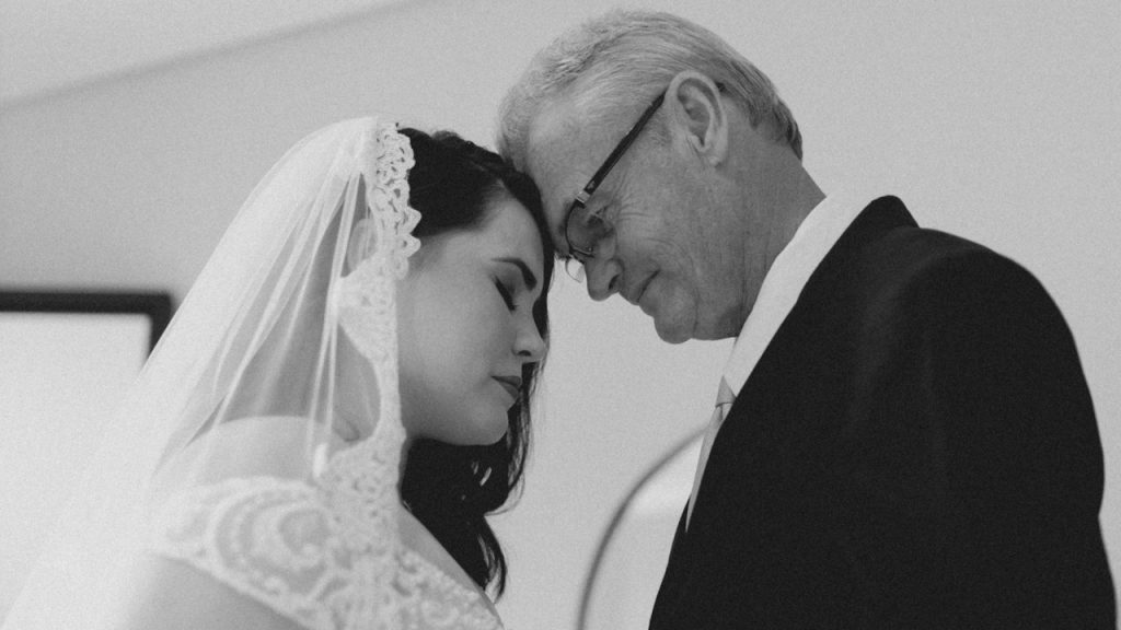 A man and a woman standing next to each other.
