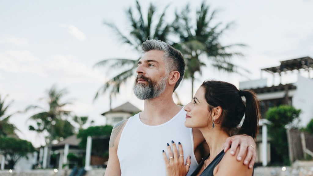 A couple walking down a street.