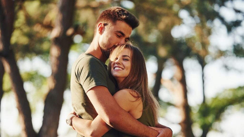 A lovely young couple embracing each other.