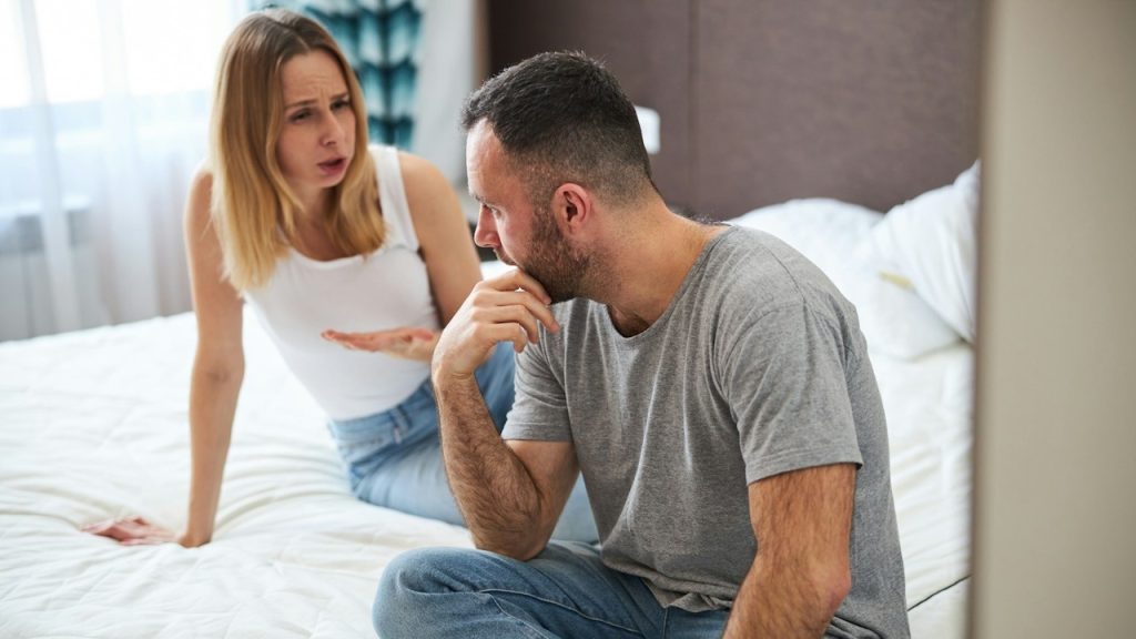 An angry woman complaining to her husband.