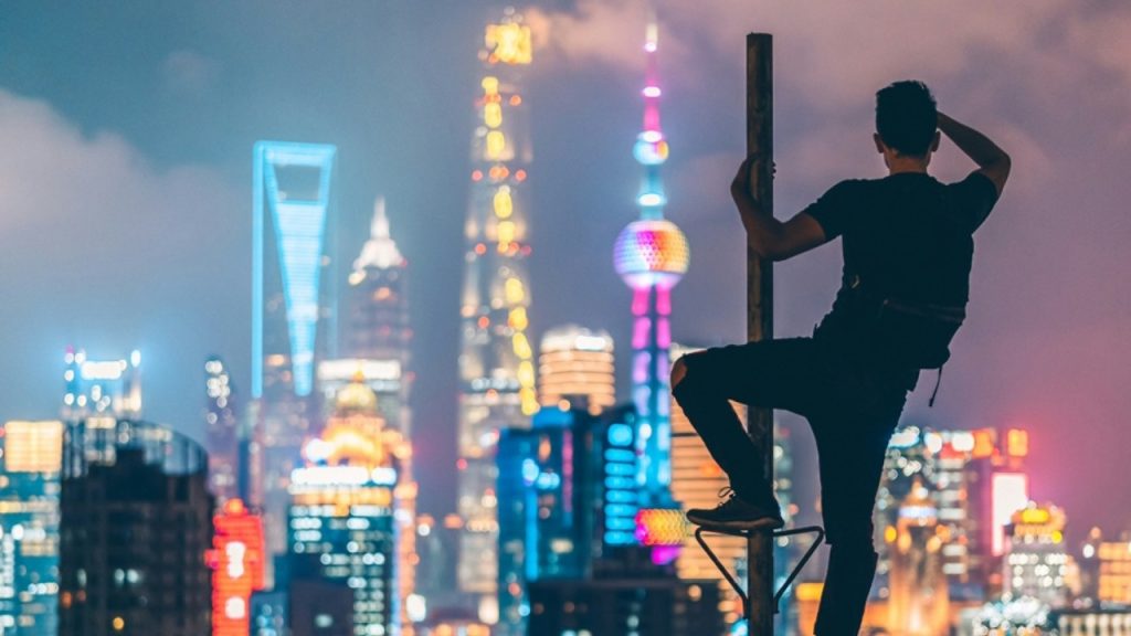 Man climbing on the rooftop.