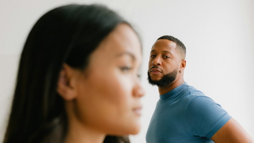 A man and a woman looking at each other.