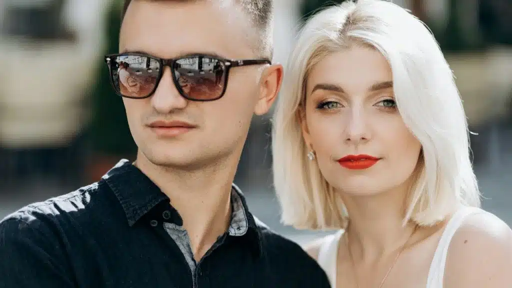 A couple standing outdoors.