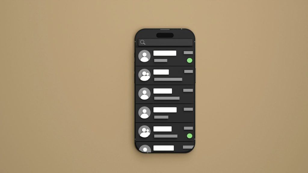 A cell phone sitting on top of a brown wall.