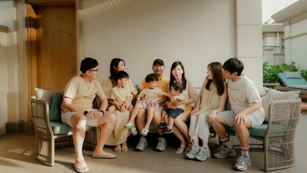 A large family gathered together on a patio.