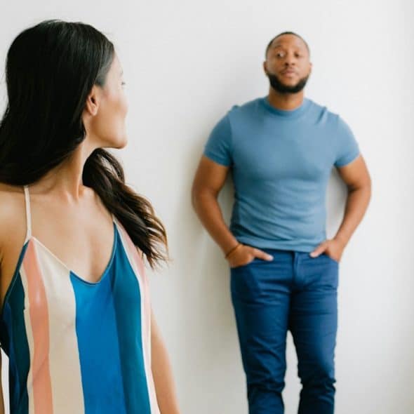 A man and a woman standing next to each other.