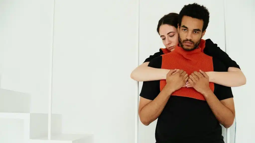 A man and a woman standing next to each other.