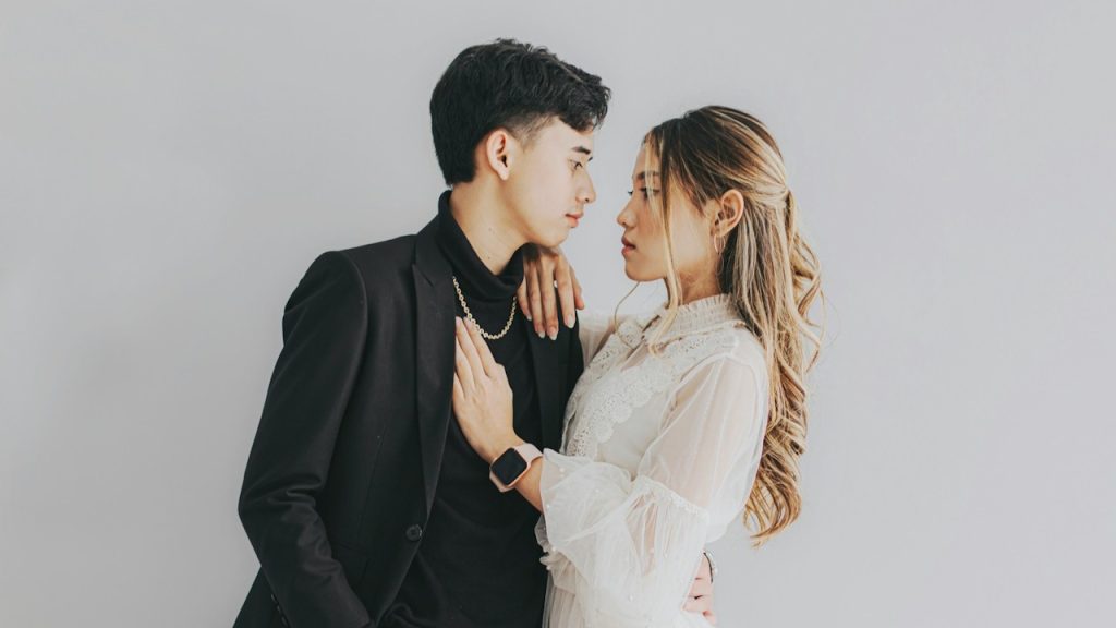 A man and a woman standing next to each other.