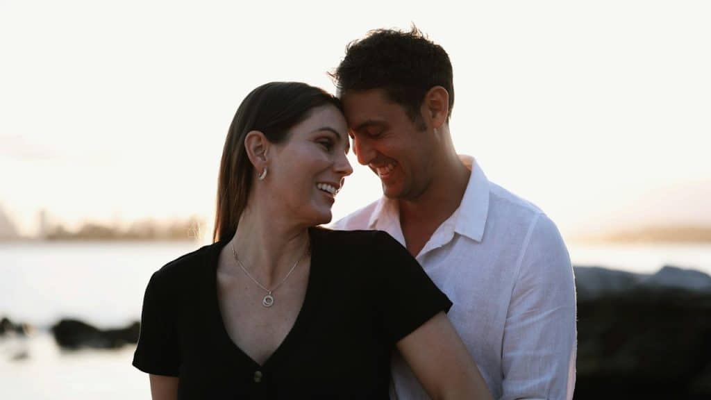 A man and a woman standing next to each other.