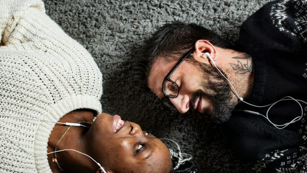 A couple listening to music together.