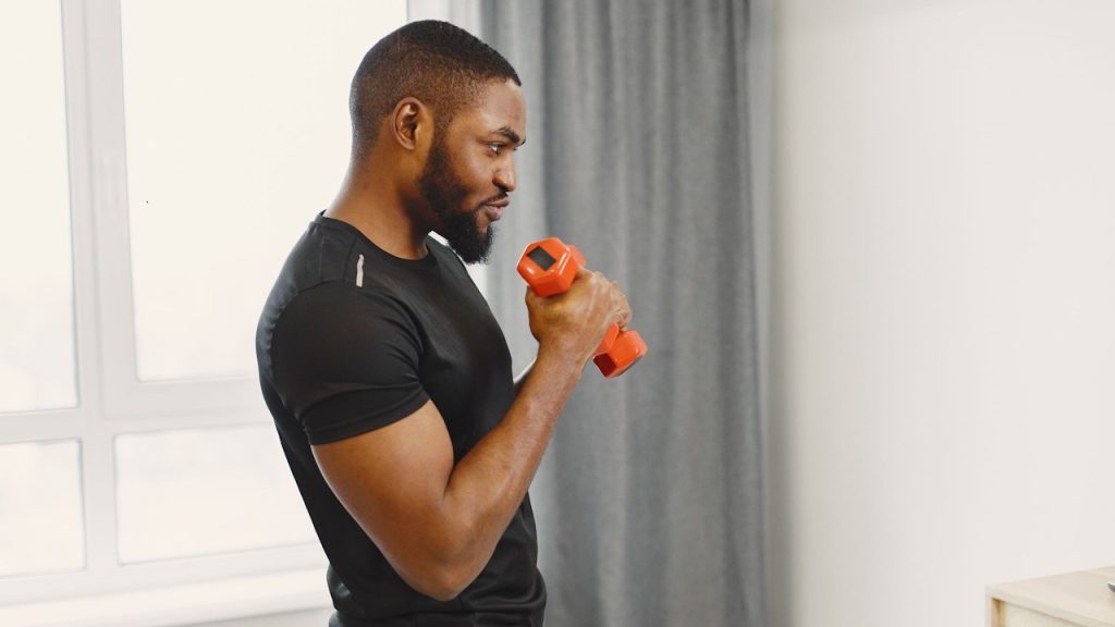 Side view of a man working out.