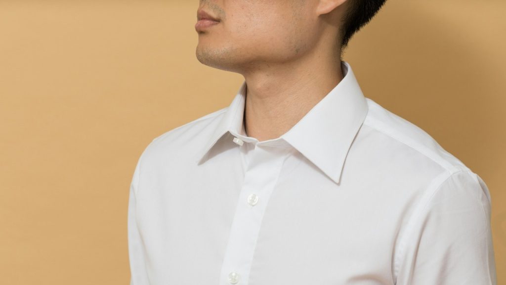 A man in a white button-up shirt.