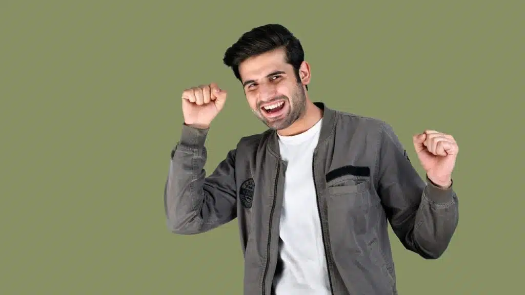 A man with his hands up.