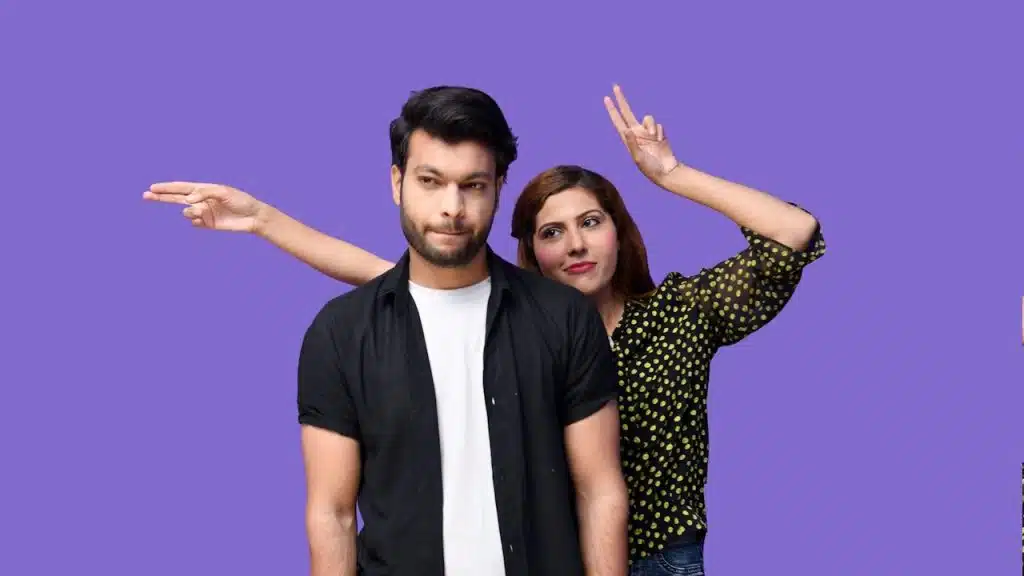 A man and woman are posing for a picture.