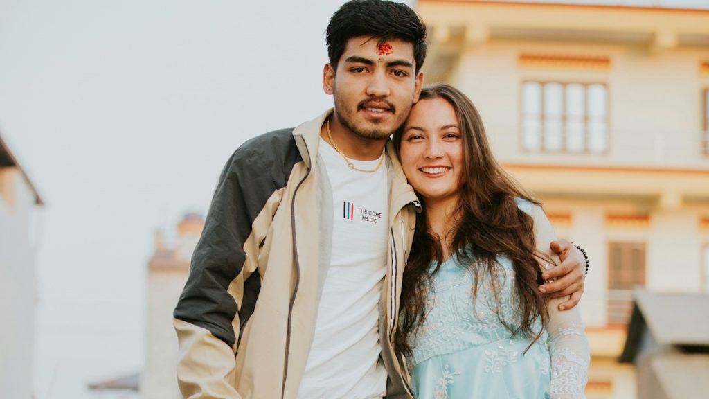 A man and a woman standing next to each other.