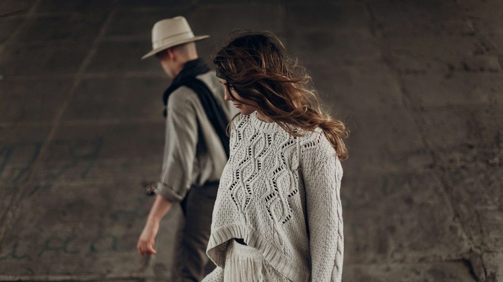 A couple walking away from each other.