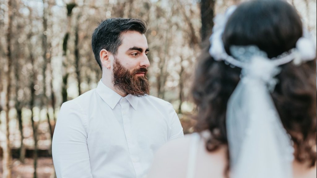 A couple standing close to each other.