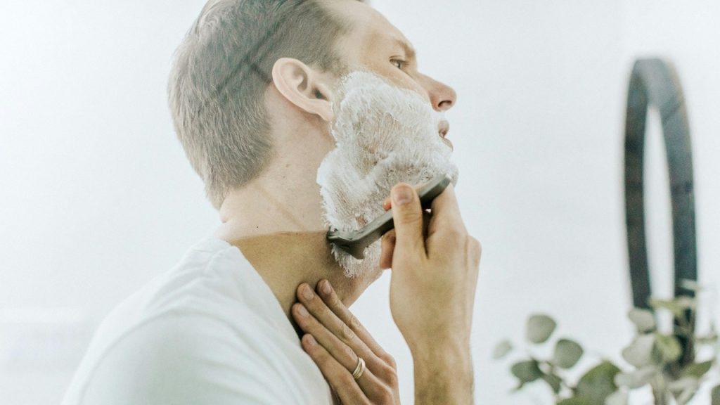 A man shaving.