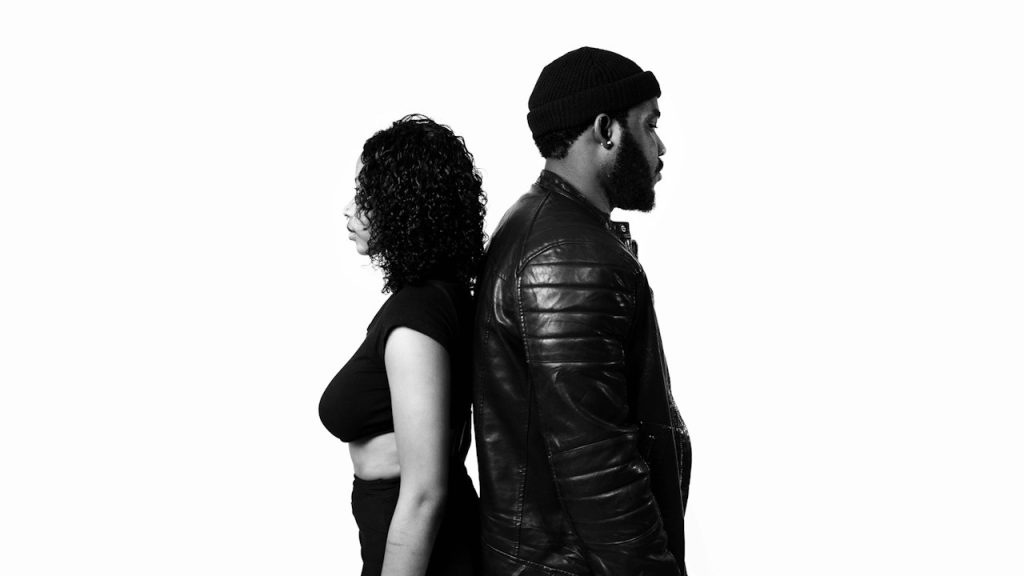 A man and a woman standing next to each other.