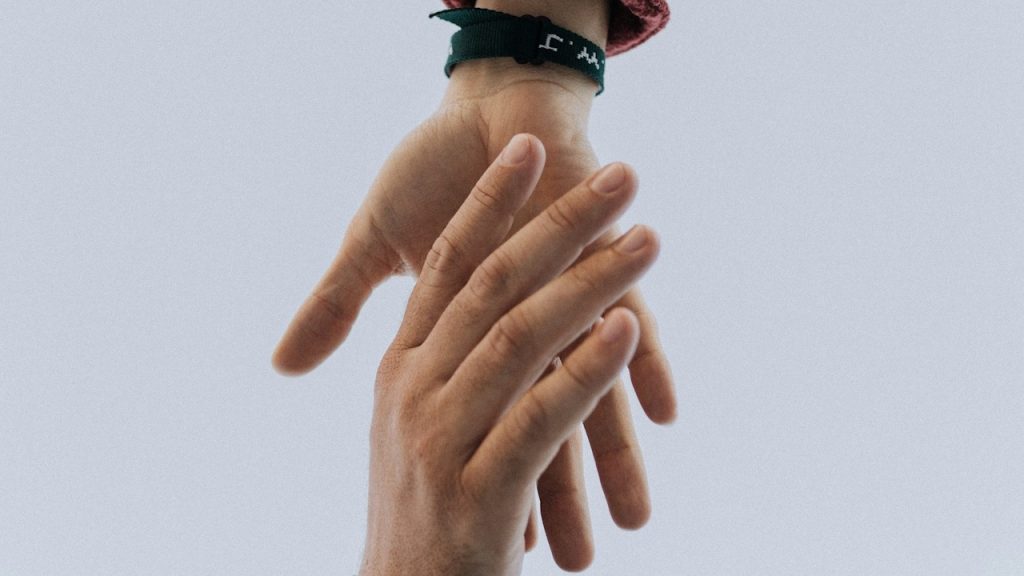 A couple holding hands.