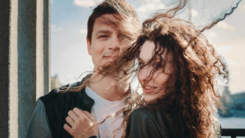 A man and woman posing for a picture.