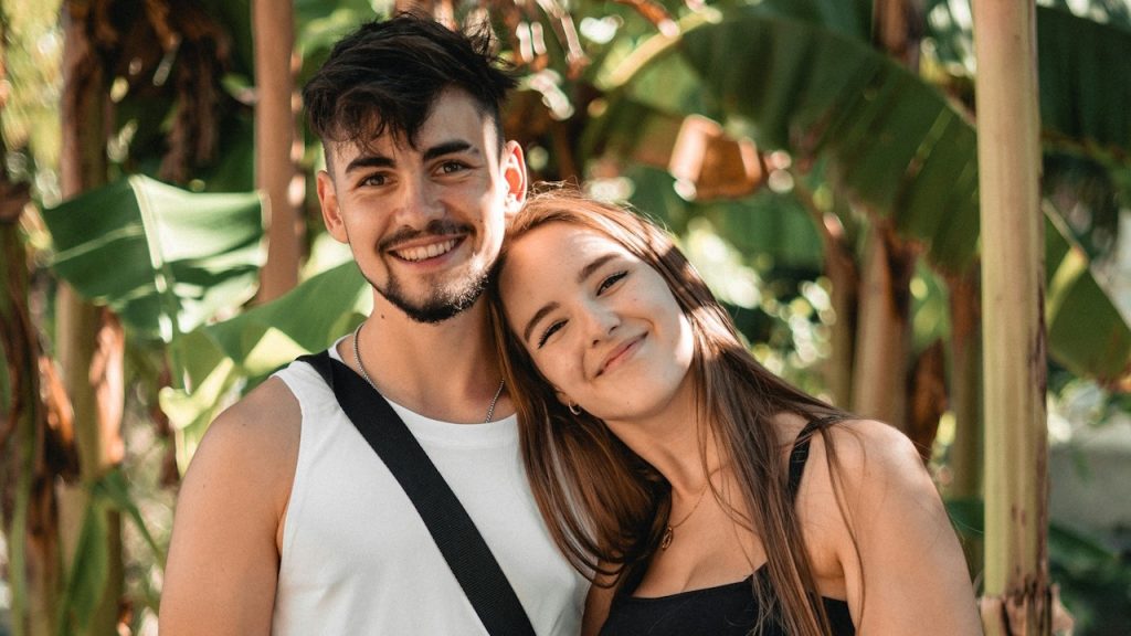 A man and woman posing for a picture.