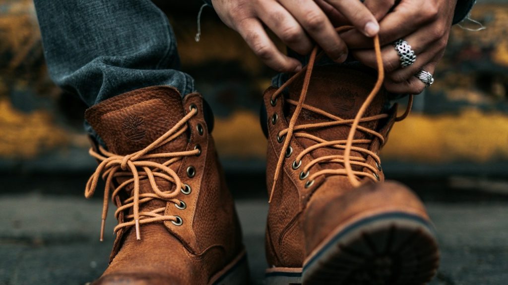 A person lacing his/her boots.