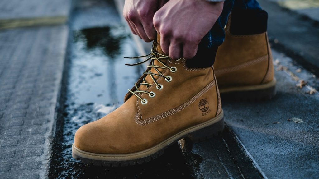 A man in brown Timberland work boots.