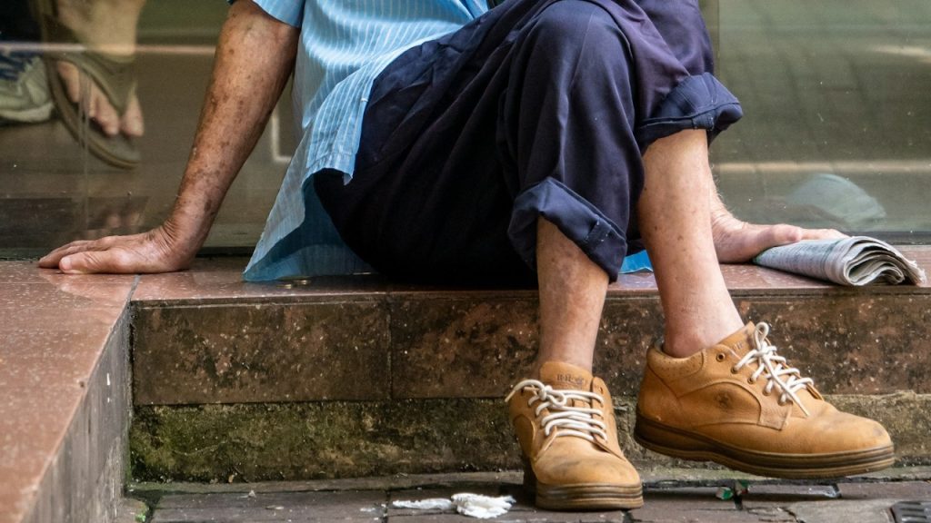 A man sitting on the floor.