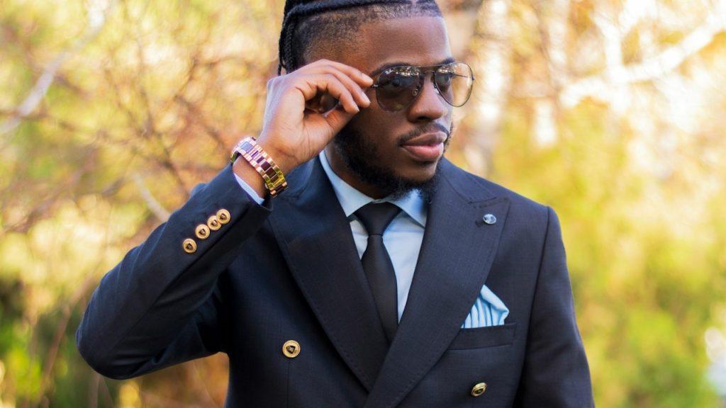 A man in a suit and tie talking on a cell phone.