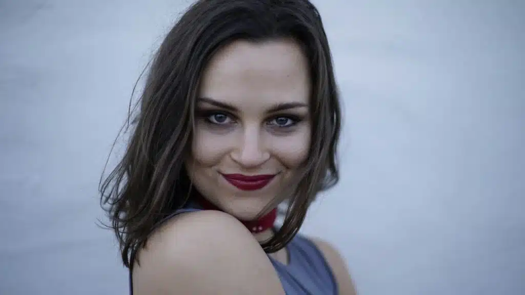 Close-up of a smiling woman.