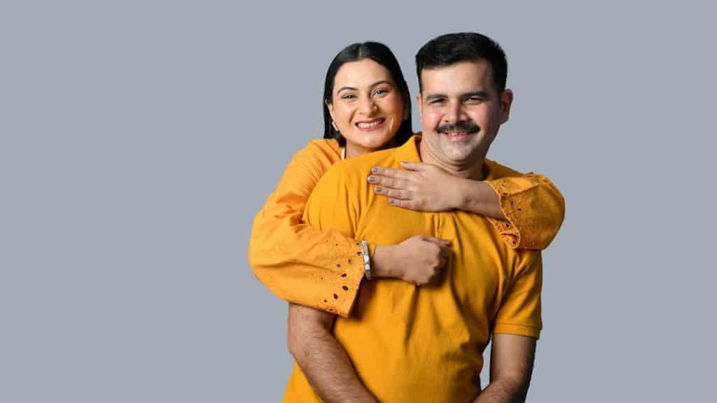 A man and woman posing for a picture.