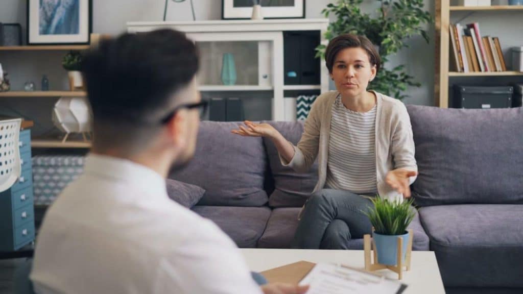 A woman is confused while the man speaks confidently.