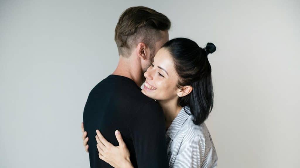 A couple hugging each other.