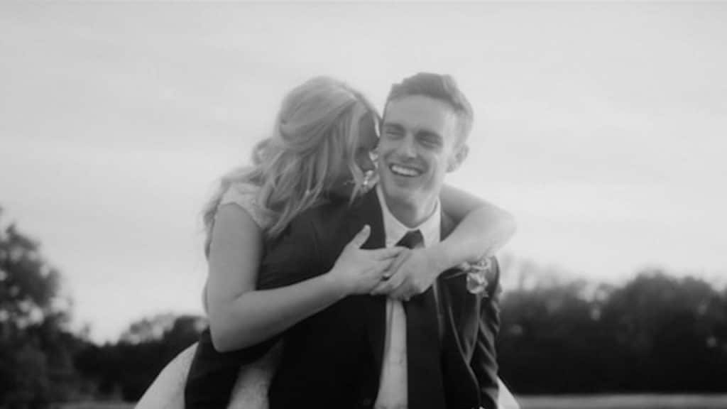 A man carrying a woman on his back.