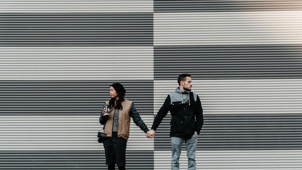 A man and a woman holding each other's hand.