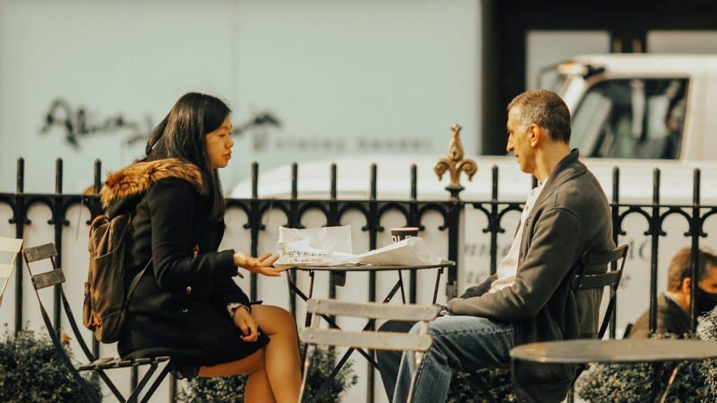 A man and woman at a table.