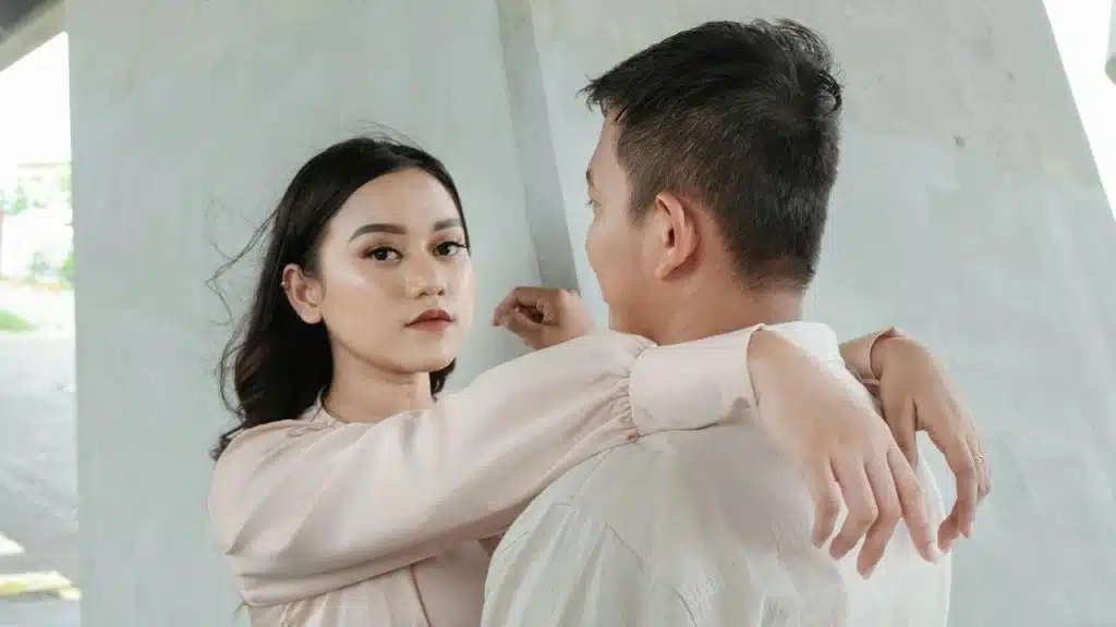 A man and a woman are standing next to each other.