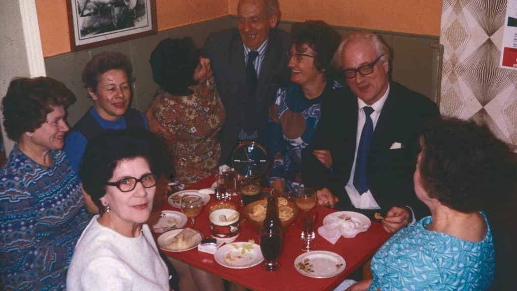 A group of people gathered around a table.