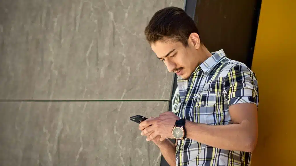 checking phone casually