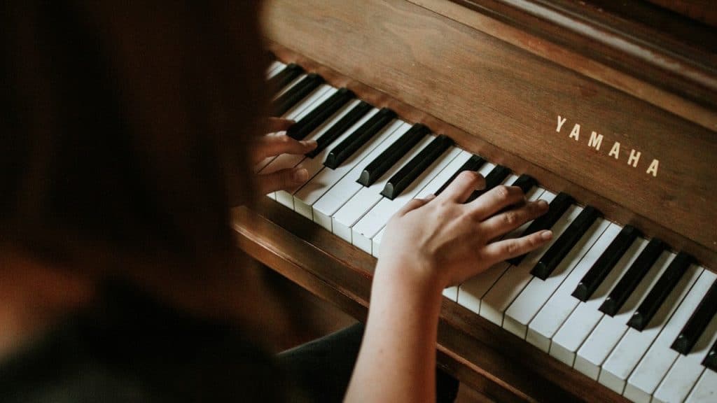 A woman playing the piano.