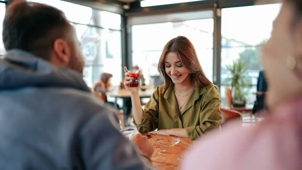 A women is blushing in front of a man