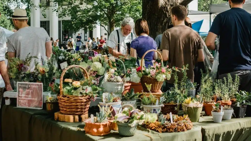 A girl showing some flower to a man in a flower shop