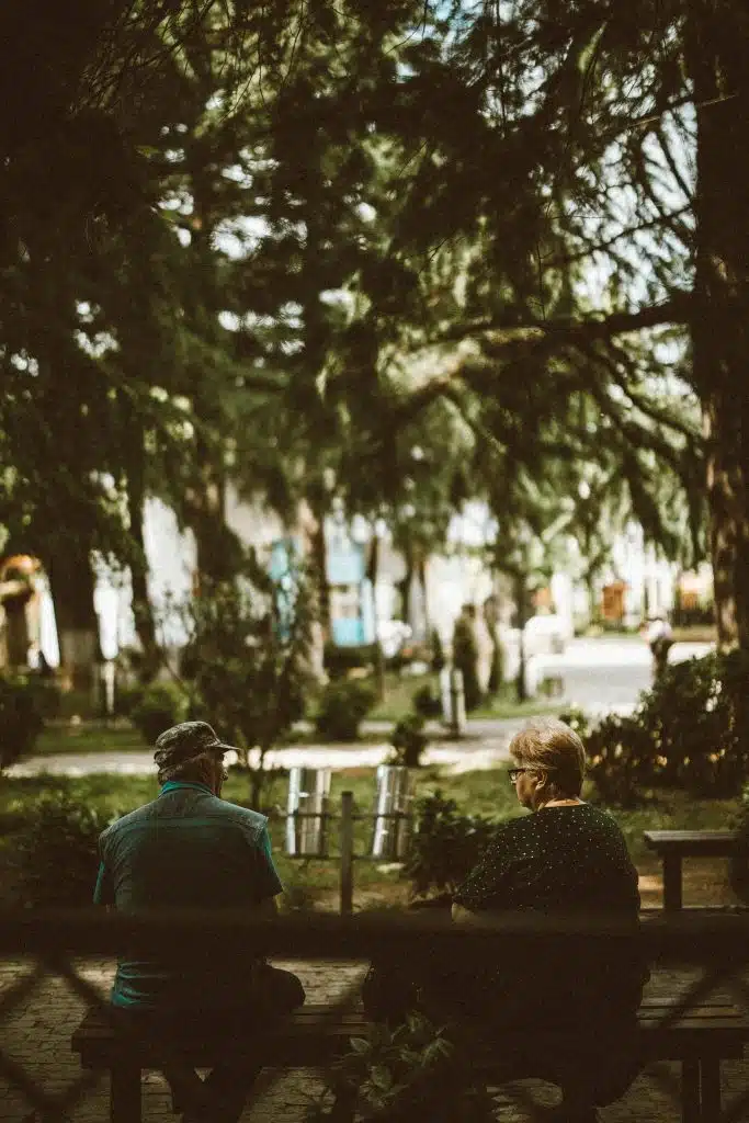 Man sitting quietly to relax while partner observes