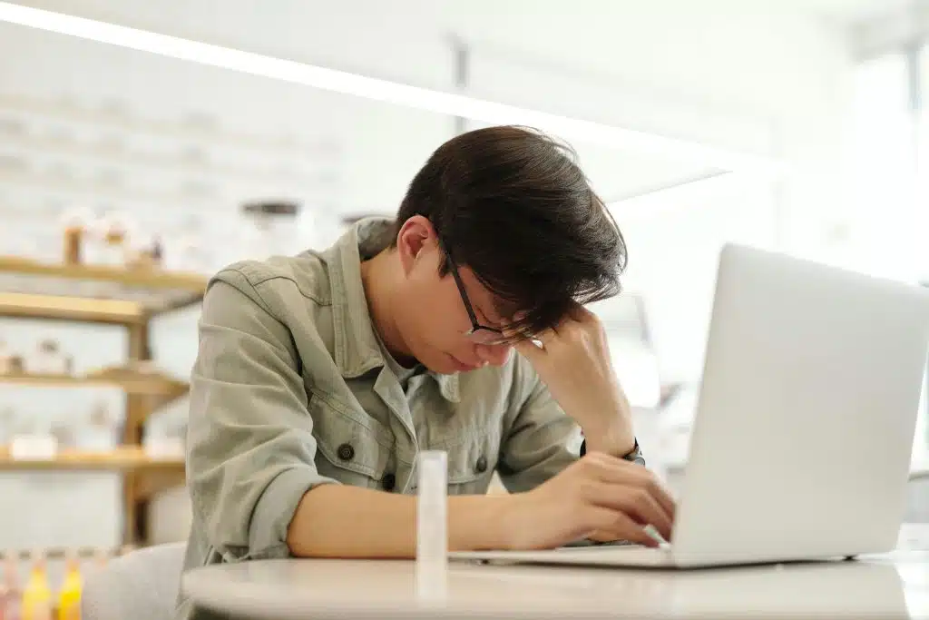 Man looking tired while handling responsibilities