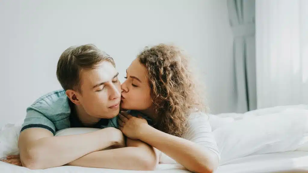 Woman kissing a man